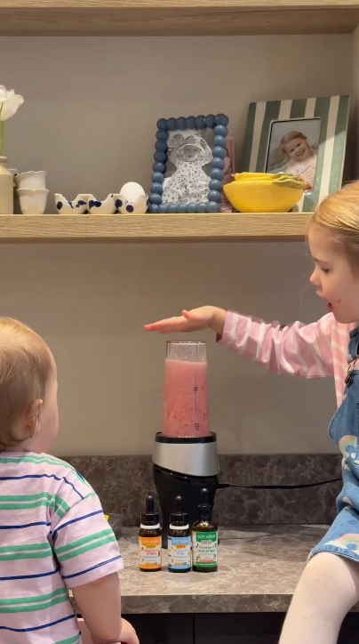 Mum in kitchen using Apokra Kids vitamins supplement lifestyle video for mums and kids wellness