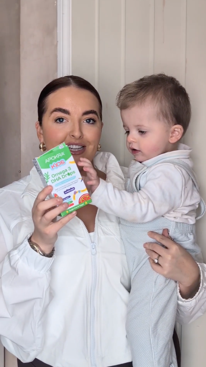 Mum holding baby and Apokra Kids Omega 3 DHA Drops product testimonial video for kids supplement